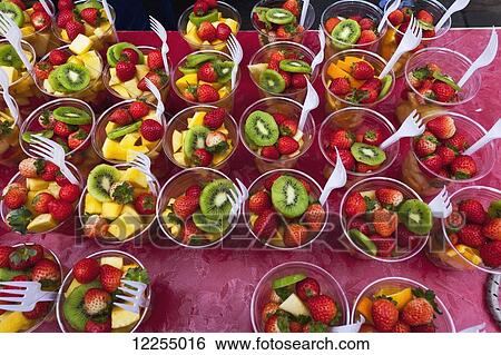 Colourful fruit cups at a juice stall at Brick Lane Market, Shoreditch; London, England View Large Photo Image Stock Photograph - Colourful fruit cups at a juice stall at Brick Lane Market, Shoreditch; London, England. Fotosearch