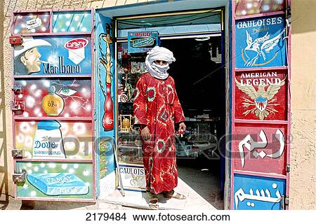 Colourful Hand-Painted Cigarete And Toiletries Advertisements Covering The Front Of Main Tobacconist In Illizi, The Capital Of The Tassili N'ajjer. Sahara Desert (Southern Algeria). View Large Photo Image Picture - Colourful Hand-Painted Cigarete And Toiletries Advertisements Covering The Front Of Main Tobacconist In Illizi, The Capital Of The Tassili N'ajjer. Sahara Desert (Southern Algeria).. Fotosearch