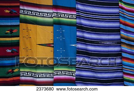 Stock Image - Colourful handmade carpets; Tulum, Mexico. Fotosearch