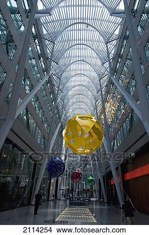 Picture - Colourful Hanging Round Objects In A Corridor With A Rounded Ceiling Of Skylights; Toronto Ontario Canada. Fotosearch