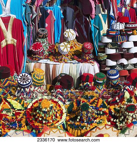 Stock Image - Colourful Hats And Clothing On Display; Morocco. Fotosearch