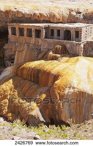 Stock Photo - Colourful hot springs and abandoned building; Mendoza, Argentina. Fotosearch