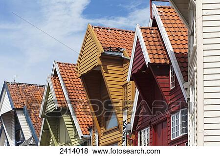 Stock Photo - Colourful houses with steep peaked tile roofs; Stavanger, Norway. Fotosearch