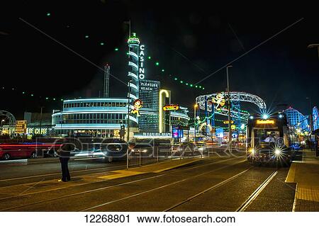 Stock Image - Colourful lights illuminate a tourist area; Blackpool, Lancashire, England. Fotosearch