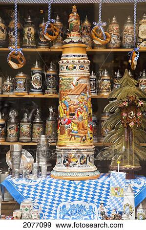Stock Photo - Colourful Ornate Souvenirs And A Cuckoo Clock On Display; Rothenburg Ob Der Tauber Bavaria Germany. Fotosearch