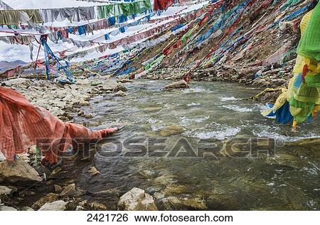 Colourful prayer flags above the river at a mountain pass near Golog city; Tibet View Large Photo Image Stock Photograph - Colourful prayer flags above the river at a mountain pass near Golog city; Tibet. Fotosearch