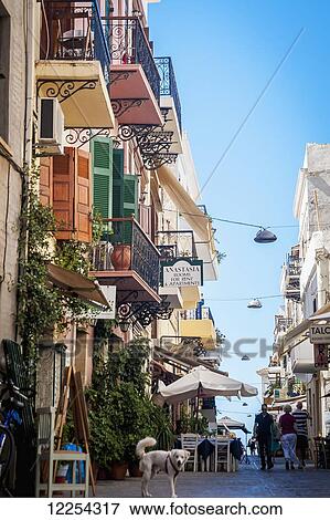 Stock Photo - Colourful residential buildings along a street in old town; Chania, Crete, Greece. Fotosearch