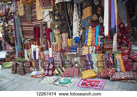 Picture - Colourful rugs and carpets on display for sale; Chefchaouen, Morocco. Fotosearch