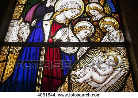 Colourful stained glass window of the birth of Jesus Christ at St. John the Baptist Church, Horsington village; Somerset, England View Large Photo Image Picture - Colourful stained glass window of the birth of Jesus Christ at St. John the Baptist Church, Horsington village; Somerset, England. Fotosearch