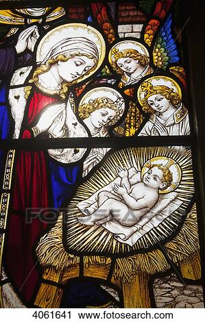 Colourful stained glass window of the birth of Jesus Christ at St John the Baptist Church, Horsington village; South Somerset, England View Large Photo Image Stock Image - Colourful stained glass window of the birth of Jesus Christ at St John the Baptist Church, Horsington village; South Somerset, England. Fotosearch