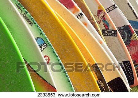 Stock Image - Colourful Surfboards In A Row; Oahu, Hawaii, United States Of America. Fotosearch