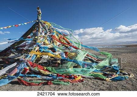Colourful Tibetan prayer flags (Lung ta) under the strong wind near Qinghai Lake; Qinghai province, Tibet View Large Photo Image Picture - Colourful Tibetan prayer flags (Lung ta) under the strong wind near Qinghai Lake; Qinghai province, Tibet. Fotosearch