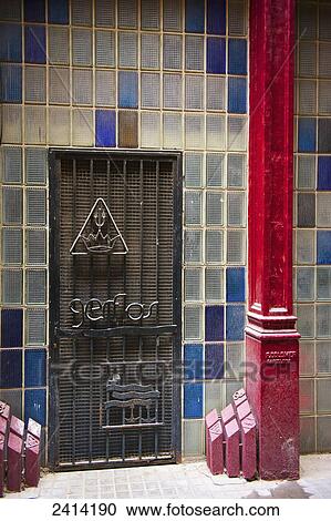 Colourful tile on a wall and a red beam beside a grate; Barcelona, Spain View Large Photo Image Stock Image - Colourful tile on a wall and a red beam beside a grate; Barcelona, Spain. Fotosearch