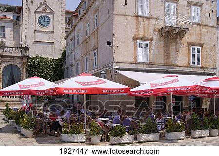 Colourful Umbrellas At Outdoor Cafe In Main Square Of Hvar Town; Hvar, Split-Dalmatia County, Croatia View Large Photo Image Stock Photo - Colourful Umbrellas At Outdoor Cafe In Main Square Of Hvar Town; Hvar, Split-Dalmatia County, Croatia. Fotosearch