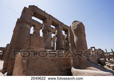 Stock Image - Columns And Monumental Statues In The Courtyard Of Ramses Ii Of The Luxor Temple, Luxor, Qina, Egypt. Fotosearch