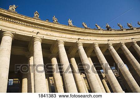 Stock Image - Columns At Saint Peter's Square, Low Angle View; Vatican City, Rome, Italy. Fotosearch