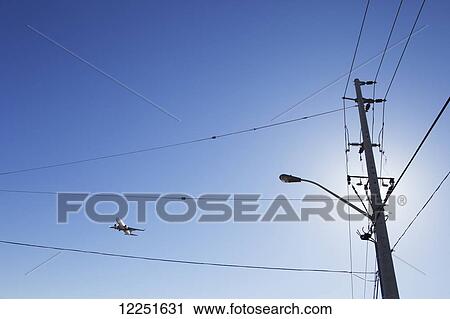 Stock Image - Commercial aircraft on final approach to land; Mississauga, Ontario, Canada. Fotosearch