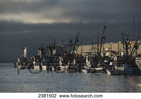 Stock Image - Commercial fishing boats dock to unload their catch; Astoria, Oregon, United States of America. Fotosearch