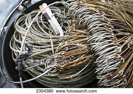 Stock Image - Commercial Halibut Fishing By Hand Using Longline Gear Out Of An Open Skiff In Kachemak Bay, Kenai Peninsula; Alaska, United States Of America. Fotosearch