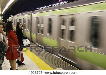 Stock Photo - Commuters In Shibuya Station. Fotosearch
