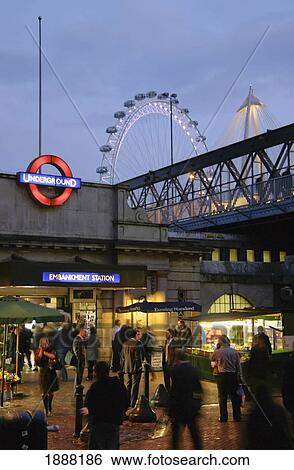 Stock Photograph - Commuters Outside Embankment Underground Station. Fotosearch