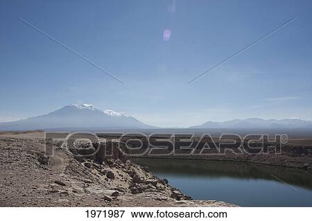Stock Photo - Conchi Dam With San Pedro & San Pablo Volcanoes In The Background, Antofagasta Region, Chile. Fotosearch