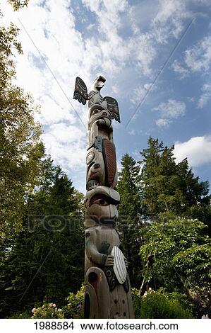 Contemporary Coast Salish Totem Pole Carved By Doug Lafortune In Butchart Gardens, Victoria, British Columbia, Canada View Large Photo Image Picture - Contemporary Coast Salish Totem Pole Carved By Doug Lafortune In Butchart Gardens, Victoria, British Columbia, Canada. Fotosearch
