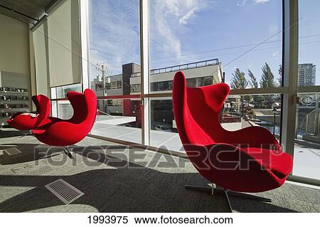 Stock Photography - Contemporary Red Chairs In The City Library, North Vancouver, British Columbia, Canada. Fotosearch