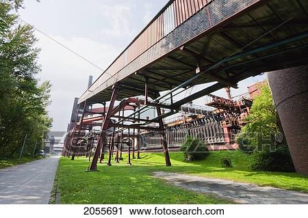 Stock Image - Conveyor And Coke Furnaces Of The Zollverein Coking Plant, Essen, North Rhine-Westphalia, Germany. Fotosearch