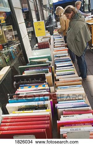 Picture - Copenhagen, Denmark; Shoppers Browsing Outside Secondhand Bookshop. Fotosearch