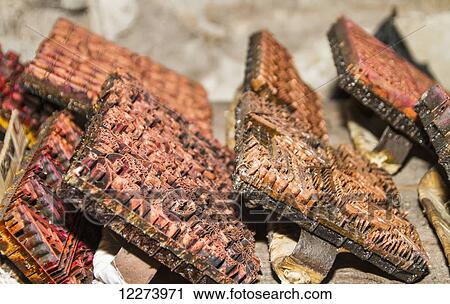 Stock Image - Copper block stamps, called cap used in the production of printed batik at Gunawan Setiawan Batik Shop, Kampung Kauman, Surakarta (Solo), Central Java, Indonesia. Fotosearch