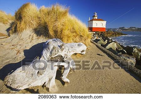 Stock Image - Coquille River Lighthouse And Bandon Beach; Oregon, United States Of America. Fotosearch