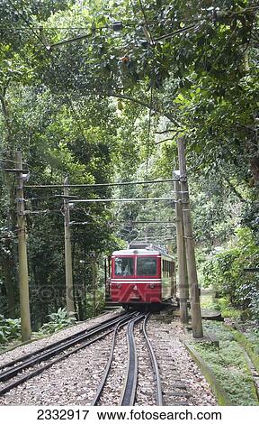 Stock Photo - Corcovado Rack Train Going To Christ The Redeemer Statue, Tijuca Rainforest; Rio De Janeiro, Brazil. Fotosearch