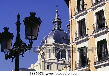 Stock Image - Corner Apartment Building On Calle Major Road With Huge Church Iglesia De La Almudena. Fotosearch