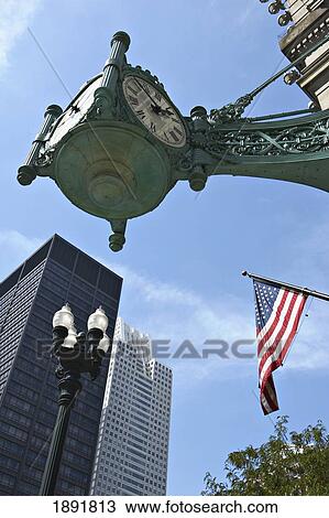 Stock Image - Corner Clock Outside Of Marshall Field And Company Building. Fotosearch