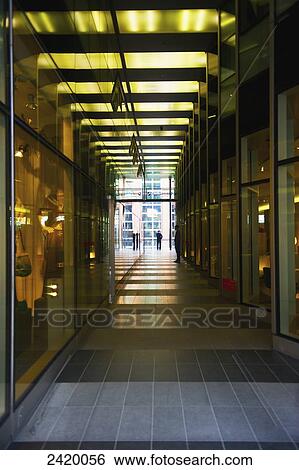 Corridor in the interior of a building with windows to retail shops; Hamburg, Germany View Large Photo Image Stock Photograph - Corridor in the interior of a building with windows to retail shops; Hamburg, Germany. Fotosearch
