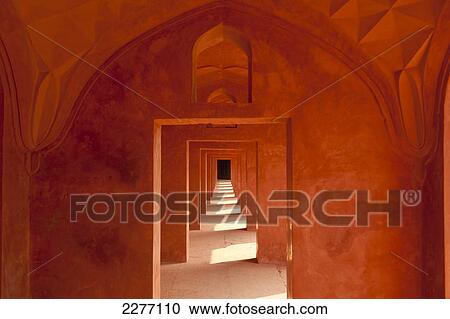 Stock Image - Corridor of sandstone in buildings beside the Taj Mahal, Agra, India.. Fotosearch