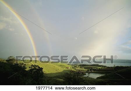 Picture - Costa Rica, Beautiful landscape with double rainbow and lake Arenal; Arnal. Fotosearch
