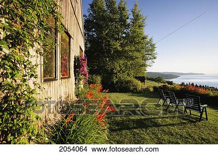 Picture - Cottage And St. Lawrence River, Charlevoix Region, Saint-Irenee, Quebec.. Fotosearch