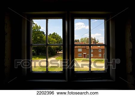 Stock Photograph - Cottage As Seen From Window In The Shipbuilding Village Of Buckler's Hard, New Forest National Park, Hampshire, Uk. Fotosearch