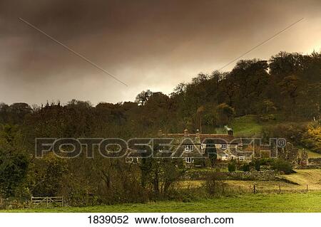 Country Houses, Dramatic Sky In Background; North Yorkshire, England, Uk View Large Photo Image Stock Image - Country Houses, Dramatic Sky In Background; North Yorkshire, England, Uk. Fotosearch