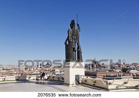 Stock Photography - Couple Admiring The View Beside The Athena Statue On The Terrace Of The Circulo De Bellas Artes; Madrid Spain. Fotosearch