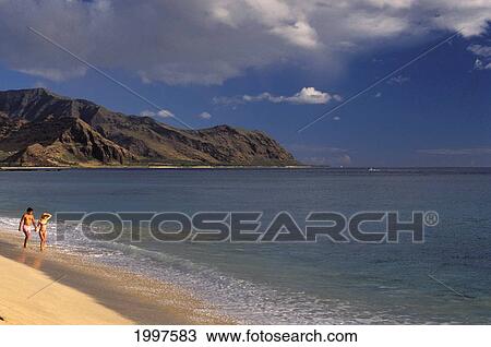 Couple At The Beach, Walking Along Water's Edge Hawaii View Large Photo Image Stock Image - Couple At The Beach, Walking Along Water's Edge Hawaii. Fotosearch