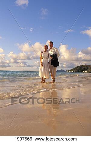 Couple At Walking By Water Dressed Up Hawaii View Large Photo Image Stock Photograph - Couple At Walking By Water Dressed Up Hawaii. Fotosearch