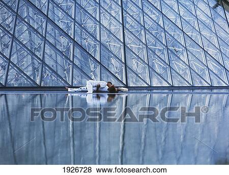 Stock Photo - Couple By The Louvre Museum. Fotosearch