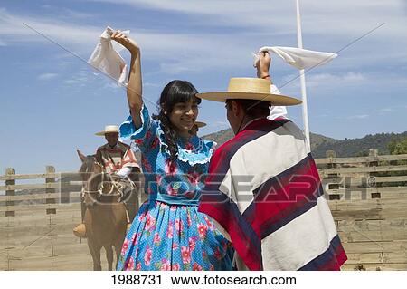 Couple Dancing Cueca, The Traditional Dance Of Chile, At The Medialuna Of Estancia El Cuadro, Casablanca Valley, Valparaiso Region, Chile View Large Photo Image Stock Image - Couple Dancing Cueca, The Traditional Dance Of Chile, At The Medialuna Of Estancia El Cuadro, Casablanca Valley, Valparaiso Region, Chile. Fotosearch