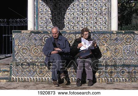 Couple During Tour Of Alcazar Gardens, Residence Of Muslim & Christian Royalty Founded In 11Th Century View Large Photo Image Stock Image - Couple During Tour Of Alcazar Gardens, Residence Of Muslim & Christian Royalty Founded In 11Th Century. Fotosearch