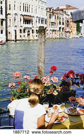Couple Eating Meal On Edge Of Grand Canal, Rear View View Large Photo Image Stock Image - Couple Eating Meal On Edge Of Grand Canal, Rear View. Fotosearch