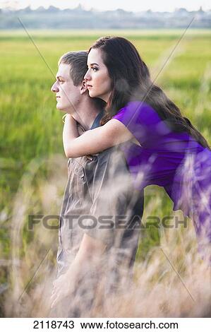 Stock Image - Couple Embracing In A Nature Reserve; Newport Beach California Usa. Fotosearch