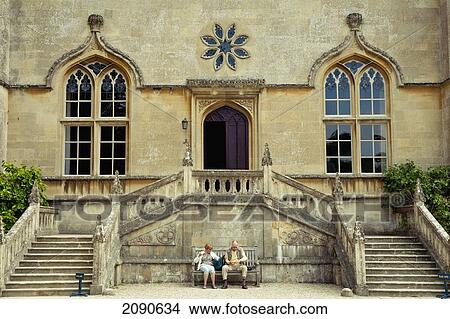 Picture - Couple Having A Snack Outside Lacock Abbey, Lacock, Wiltshire, Uk. Fotosearch